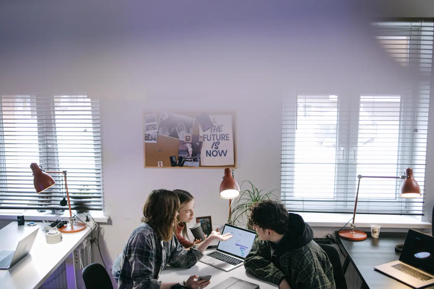 Colleagues working together on a laptop